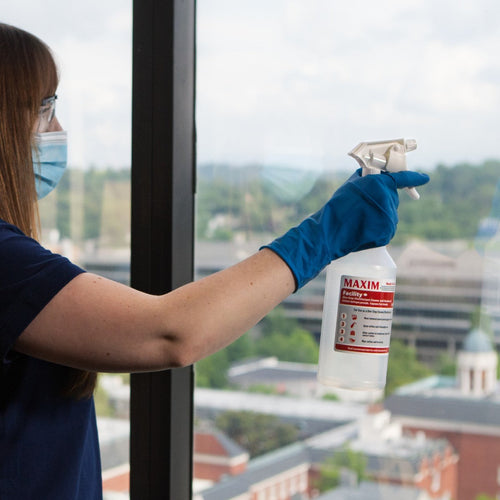 Maxim® Facility+ One-Step Disinfectant Cleaner & Deodorant RTU Spray Bottles in Use Thumbnail